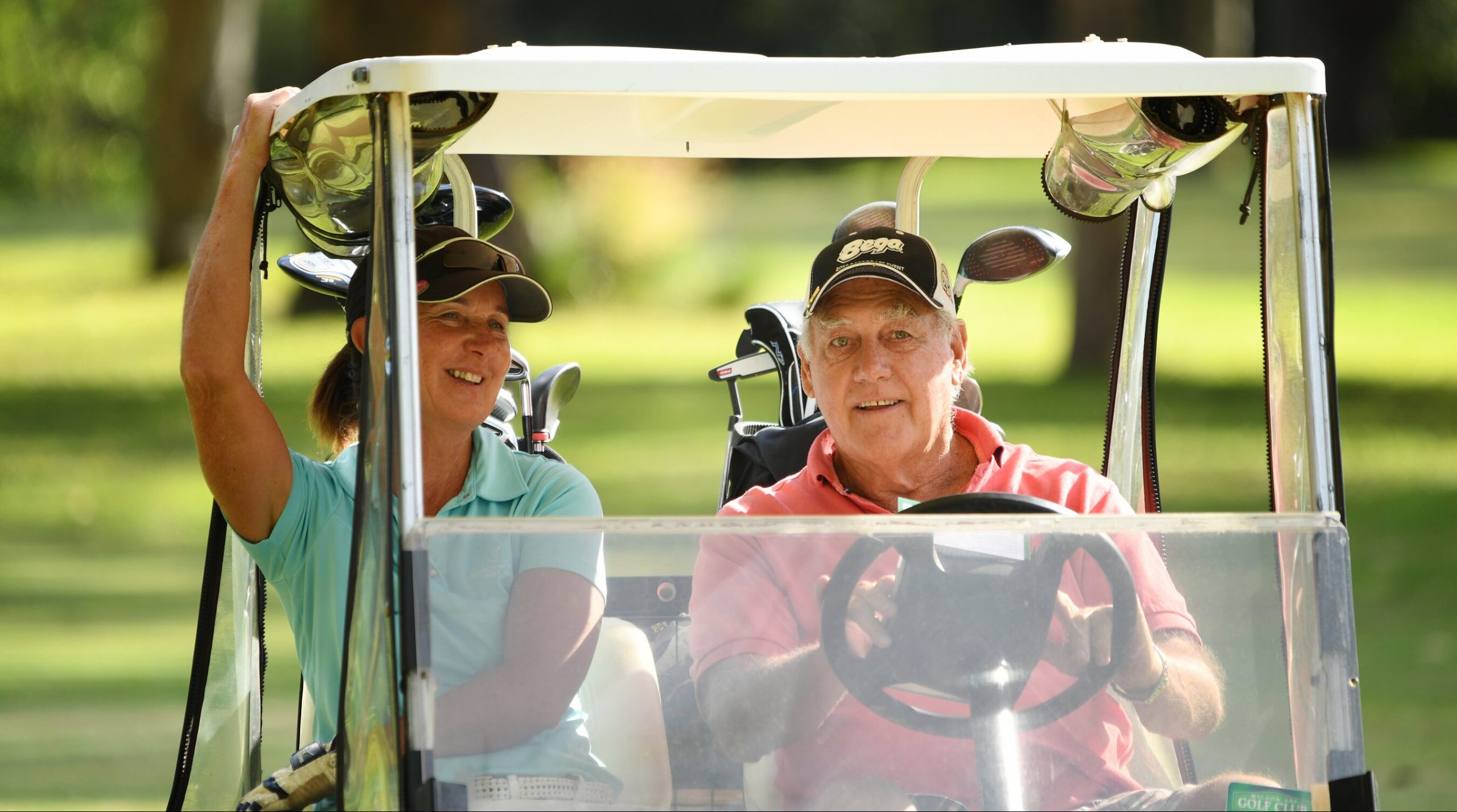 people in golf cart